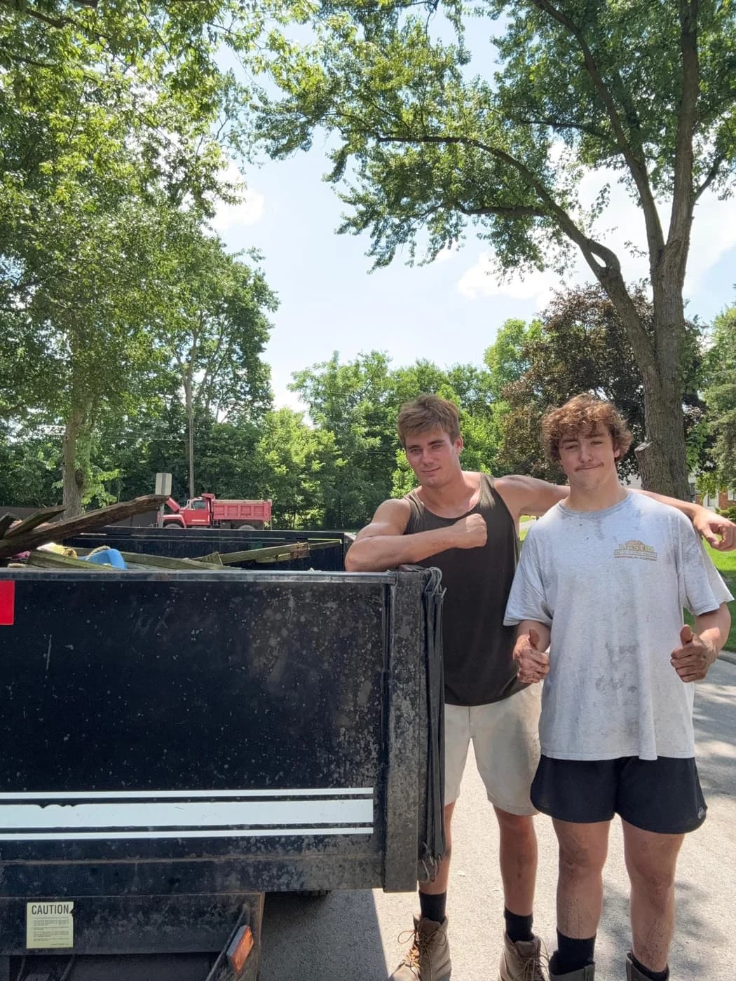 Power House Junk Removal crew with dump trailer